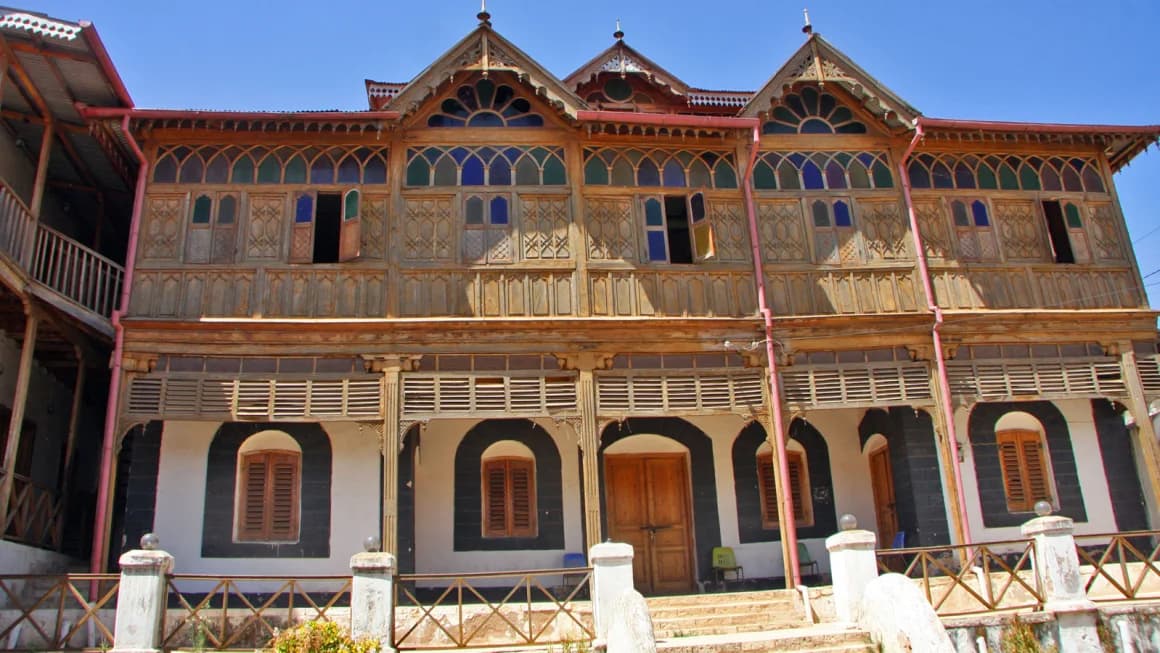 Traditional ornate wooden house with stained-glass windows in Harar, Ethiopia