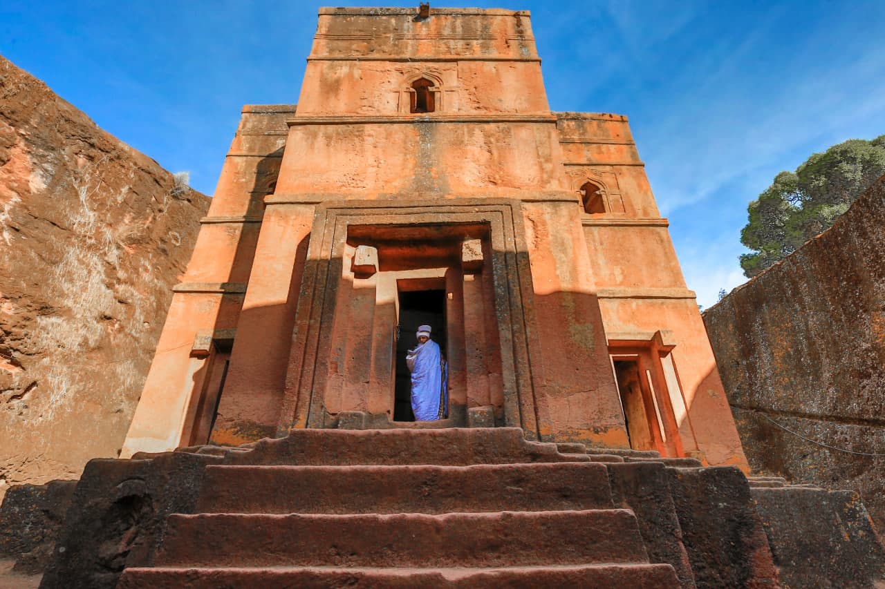 View of Lalibela's rock-hewn church towers framed by an archway